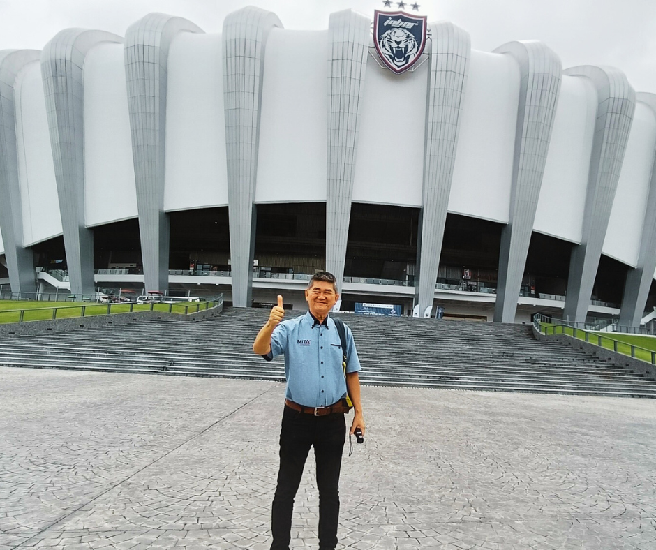 Founder of abcde.my Wong Toong Poo with MITA uniform stand infront of JDT Stadium Johor Malaysia